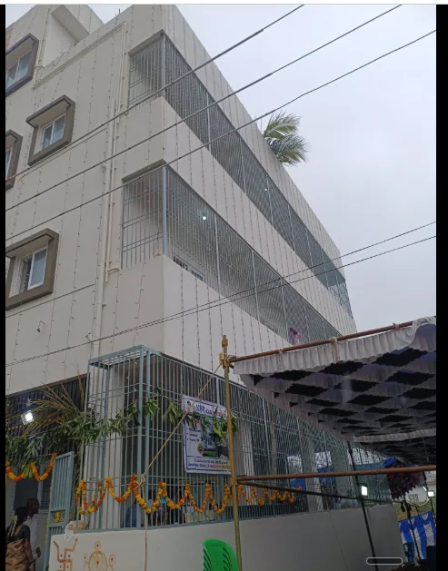 Side view of the same tall multi-storey residence with screened edges and a covered ground level.